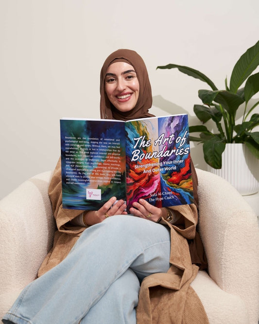 Woman reading 'The Art of Boundaries' book in a cozy indoor setting