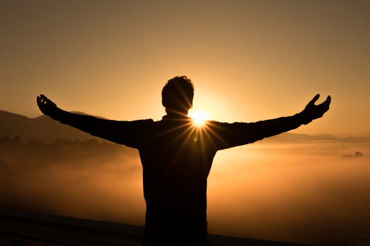 Woman standing confidently in her own light