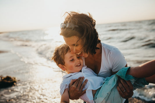 Mother and child sitting together in peaceful moment of connection and healing