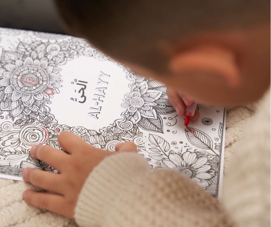 Person coloring a detailed mandala design on a coloring book with a red marker.